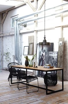 an image of a table with chairs and pictures on it