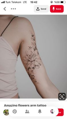 a woman's arm with flowers tattooed on it