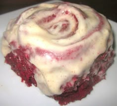 a close up of a piece of cake on a plate with frosted icing