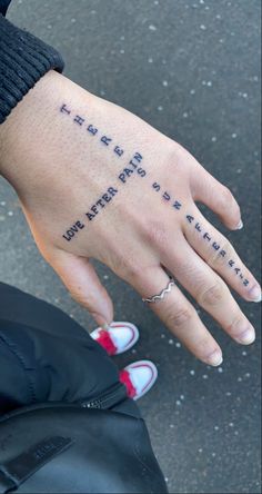 a woman's hand with the words friends and family written on her left wrist