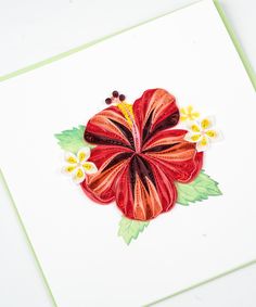 a close up of a flower on a card