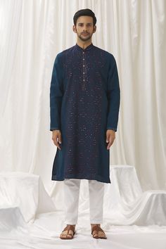 Blue kurta with thread embroidered floral patterns and mirrorwork embellishments. Comes with pant. - Aza Fashions Bollywood Style Blue Sherwani With Floral Embroidery, Indigo Kurta With Chikankari Embroidery For Festivals, Indigo Kurta With Floral Embroidery For Eid, Blue Cotton Traditional Wear With Mirror Work, Indigo Floral Embroidered Kurta For Eid, Traditional Blue Sherwani With Floral Embroidery, Traditional Blue Kurta With Mirror Work, Blue Kurta With Mirror Work For Festivals, Blue Sherwani With Mirror Work For Festivals