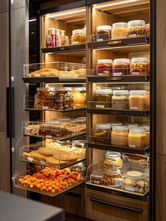 a refrigerator filled with lots of food inside of a kitchen next to a counter top