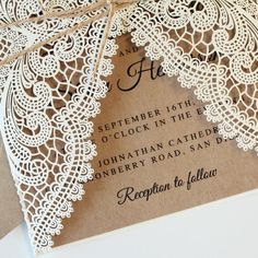 a wedding card with lace on it