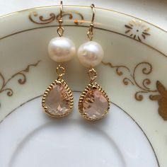 Gold Freshwater Pearl Champagne Blush Earrings Pink Peach Jewelry - Bridesmaid Earrings - Wedding Jewelry Earrings measure approximately 1.5 inches long and are made with 14k gold filled earwires. Can be made in silver. Shipped in a gift box for easy gift giving. Elegant Champagne Earrings For Gift, Champagne Dangle Earrings For Wedding, Champagne Drop Earrings For Wedding, Pink Pearl Drop Earrings For Wedding, Pink Pearl Earrings For Wedding, Champagne Color Drop Earrings For Gift, Pink Pearl Drop Bridal Earrings For Wedding, Pink Pearl Bridal Earrings For Wedding, Delicate Gold Earrings For Bridal Shower