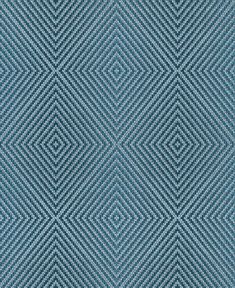 a blue and white diamond pattern on fabric