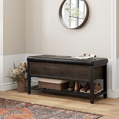 a wooden bench sitting in front of a mirror on top of a wall next to a rug