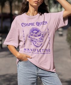 ✨ Cosmic Queen Spiritual Manifest Tshirt. This mystical shirt would make a beautiful addition to any hippie clothes collection, or a meaningful gift for the spiritual gangster in your life!  This positive affirmation t-shirt was designed to help you amplify your positive intentions and manifest your wildest dreams. 👕 Available in multiple colours, and sizes S-5XL. PLEASE NOTE: This is unisex sizing - please refer to the size chart in the photos before placing your order. 100% cotton. 🕞 Please note that this item is made to order, therefore will take 3-7 working days to be made prior to dispatch. 🌱 One tree planted per order. 🚛💨 Estimated Delivery Times (working days): UNITED KINGDOM 3 - 5 working days FRANCE 3 - 5 working days GERMANY 1 - 4 working days IRELAND 5 - 7 working days CANA Spirituality Shirts, Crystal Tshirt, Mystical Graphic Print Short Sleeve Top, Mystical Short Sleeve Top With Graphic Print, Mystical Graphic Print Crew Neck Top, Mystical Graphic Print Cotton Tops, Mystical Cotton Tops With Graphic Print, Mystical Cotton Crew Neck T-shirt, Mystical Crew Neck Cotton T-shirt