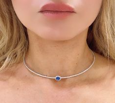 Experience the timeless elegance and luxury of our 2.64carat choker with oval cut blue sapphire center tennis necklace. The stunning oval cut blue sapphire center adds a touch of sophistication to any outfit, while the sleek choker design exudes glamour. Elevate your style with this must-have piece. Metal: 14K White GoldDiamond Details: 108 Brilliant Round Cut Diamonds 1.45ct tw Blue Sapphire: Oval-cut 1.19carat Lenght: 14 + 2" - W: Sapphire center: 10 x 7mm Necklace Guide, Choker Design, Choker Designs, Diamond Initial Necklace, Jewelry Appraisal, Bridal Engagement Rings, Eternity Wedding Band, Jewelry Rings Diamond, Tennis Necklace