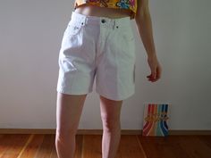 "White wash denim shorts really make a Summer tan pop! Color: White Fabric: 100% cotton on stretch denim Brand: Navy Blue Clothing Company (estimated 1990s era vintage retro jean shorts) Bermuda length Zipper and Single Button Closure Flaws: some wear on the inside thigh seam - item is in good vintage condition for an estimated 90s era piece. About the Fit: Model is 5,7\" and usually wears a modern women's size S - M / 28 / US 4 - 6. The shorts are tight on the model please see the measurements Y2k High Rise Cotton Shorts, Y2k Style Cotton Shorts For Spring, Spring Y2k Style Cotton Shorts, Spring Y2k Cotton Shorts, Y2k High Waist Cotton Shorts, White 90s Style Shorts For Summer, Y2k Style White Bottoms Short Length, White 90s Style Summer Shorts, Y2k Style White Short Bottoms