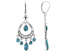 Introducing our dazzling Blue Composite Turquoise Sterling Silver Dangle Earrings! These beauties are a must-have for any jewelry lover looking to add some playful elegance to their collection. Crafted with love and attention to detail, these earrings feature stunning blue composite turquoise gemstones that will make you stand out from the crowd. The leverback style adds an extra touch of security while wearing them so you can dance all night worry-free. With dimensions measuring 2.10 inches in Elegant Turquoise Metal Chandelier Earrings, Southwest Style, Sterling Silver Dangle Earrings, Turquoise Blue, Turquoise Gemstone, Jewelry Lover, Turquoise Sterling Silver, Dangle Earrings, Turquoise