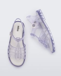 Step into the Melissa Possession Fresh, a new take on the beloved original jelly. With an open toe for a breezier feel, it retains the iconic fisherman-style upper and adjustable buckle. Lightweight, versatile, and 100% recyclable, it embraces timeless Melissa style with a more traditional sandal silhouette. Spring Clear Closed-toe Jelly Sandals, Spring Clear Closed Toe Jelly Sandals, Clear Closed Toe Jelly Sandals For Spring, Spring Jelly Sandals With Adjustable Strap, Spring Jelly Sandals With Adjustable Strap And Round Toe, Trendy Spring Jelly Sandals With Adjustable Strap, Casual Clear Sandals For Spring, Casual Transparent Sandals For Spring, Casual Jelly Sandals With Adjustable Strap For Spring