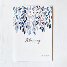 a white card with blue leaves and the word february written on it in cursive writing