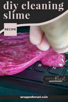 a person using a pink plastic bag on top of a computer keyboard with the words diy cleaning slime