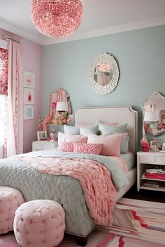 a bedroom decorated in pink and aqua blue