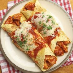 three pieces of nachos on a plate with sauce and parmesan cheese