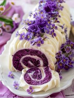 there is a cake with purple flowers on it