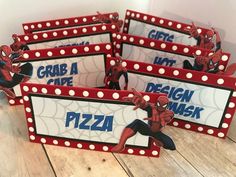 spider - man place cards are shown on a table