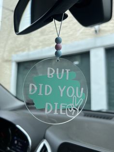 a car dashboard with a sign that says, but did you die?