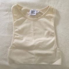 Never Worn 10/10 Condition Great For Casual Or Activewear Summer Beige Ribbed Crop Top, Summer Ribbed Beige Crop Top, Cream Stretch Crop Top For Spring, Trendy Fitted Cream Crop Top, Trendy Cream Fitted Crop Top, Cream Fitted Trendy Crop Top, Spring Seamless Cream Top, Spring Cream Seamless Tops, Active Top