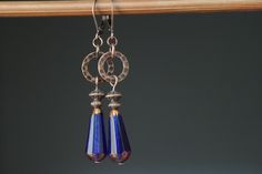 Navy Blue Earrings Czech Glass Earrings Long Dangle Drop Earrings Boho Earrings Boho Jewelry Gift for her Gift for women Color : Sapphire Blue 20x9mm Faceted Teardrop Beads, Dark Bronze Finish, Translucent, Czech Republic Glass Beads Finish : Antiqued copper findings Length : Approx 2 1/4 inches including the antique copper lever back Ear wires : Antique copper lever back Czech Glass Earrings : https://www.etsy.com/shop/NtikArtJewelry?ref=hdr_shop_menu§ion_id=16062218 Thanks for looking Blue Teardrop Copper Earrings, Blue Copper Teardrop Earrings, Boho Jewelry Earrings, Dark Blue Earrings, Navy Blue Earrings, Mixed Metal Earrings, Orange Earrings, Teardrop Beads, Blue Jewelry