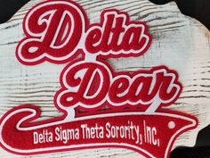 the delta bear logo is displayed on a wooden sign that says delta bear, delta theater sorry, inc