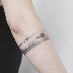 a person with a small tattoo on their arm