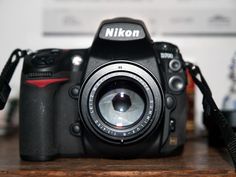 a camera sitting on top of a wooden table