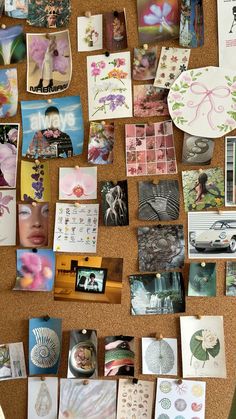 a cork board covered in lots of different pictures