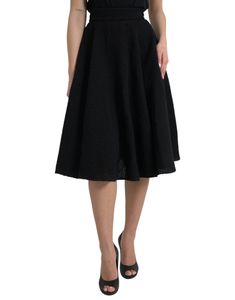 This Dolce & Gabbana skirt has a knee-length cut and sits high on the waist. Made in Italy with 80% virgin wool, 11% silk, and 9% nylon, this black skirt features a back zipper closure. Model: High waist skirt Color: Black Material: 80% Virgin Wool 11% Silk 9% Nylon Back zipper closure Flare Made in Italy Skirt Tops, Black A Line Skirt, High Waist Skirt, Black High Waist, Dolce E Gabbana, Knee Length Skirt, Clothes Collection, Dolce & Gabbana, Cardigan Jacket