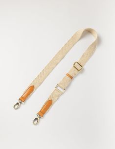 Looking to accessorize your O My Bag? Our sand coloured herringbone webbing strap is the perfect add-on for those who like a neutral color palette.This updated design measures 4cm in width, which is slightly thinner compared to our original webbing straps. All O My Bags with a detachable strap design can be styled with the sand webbing strap. OMB-sandcognacstrap Cognac Leather Bag, Neutral Color Palette, My Bags, Sustainable Leather, Antique Brass Hardware, Webbing Strap, Candle Accessories, My Bag, Black Sand