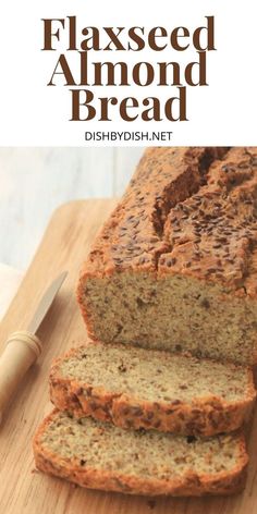 sliced banana bread on a cutting board next to a knife and fork with the words flaxed almond bread