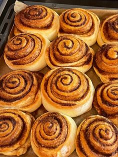 there are many cinnamon rolls in the pan