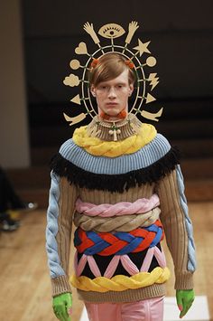 a model wearing an unusual outfit on the runway