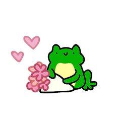 a green frog sitting on top of a white table next to pink flowers and hearts