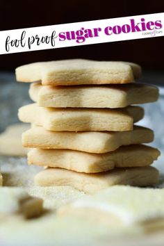 a stack of shortbread cookies sitting on top of a table next to a sign that says fool proof sugar cookies