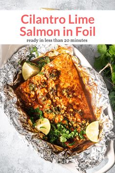 a plate with some food on it and the title reads, cilantro lime salmon in foil ready in less than 20 minutes