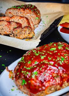 the meatloaf is covered with ketchup and green sprinkles