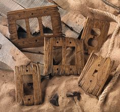 several pieces of wood sitting in the sand