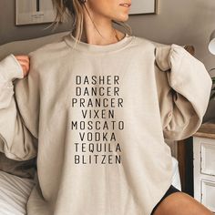 Dasher Dancer Prancer Vixen Moscato Vodka Tequila Blitzen Sweatshirt, Funny Christmas Sweatshirt, Christmas Shirts, Christmas Sweater WELCOME TO "DandelionDesignUShop" ! High quality and super soft, comfortable shirt. Made with top of the line vinyl and pressed with a professional grade heat press. All our simple color ones like White, Black, and Red are 100% Cotton. All our Heathered Colors are cotton/polyester blend and they are super comfy soft!   SIZING AND COLORS Make sure you check our size-chart before you place your order. If you are not sure about sizing please measure your favorite t-shirt and compare measurements to the chart for the best fit for you. For detailed sizing information and t-shirt color options, please see listing images.   HOW TO ORDER   𝟏. Please, Check and Revi Funny Xmas Sweatshirts, Christmas Sweatshirts Vinyl, Funny Christmas Shirts For Women, Holiday Tees, Holiday Pjs, Christmas Shirt Funny, Funny Christmas Sweaters, Fashion And Beauty Tips, Moscato