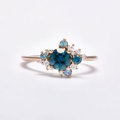 an engagement ring with blue and white diamonds