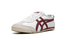 The Onitsuka Tiger Mexico ‘66 “White/Burgundy” is an eye-pleasing colorway of the retro sneaker by the Japanese footwear brand.  The Onitsuka Tiger Mexico ‘66 was originally a performance running shoe that debuted in 1966 during the trials for the Mexico City summer olympics in 1968, and through the years it has become a popular casual shoe.  The modern iteration of the model is largely similar to the original edition, but is made with contemporary materials and colors.  Here, “White/Burgundy” colorway has a white leather construction with burgundy tiger stripes on the sides.  “Onitsuka Tiger” branding is found on the tongue tag.  A vintage-inspired, thin cream foam midsole and rubber outsole complete the sleek design. Vintage White Sneakers With Gum Sole, Vintage White Sneakers With Vulcanized Sole, Retro White Sneakers With Rubber Sole, Tiger Branding, Japanese Footwear, Contemporary Materials, City Summer, Tiger Mexico 66, Onitsuka Tiger Mexico 66