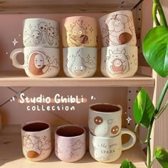 coffee mugs are sitting on the shelf