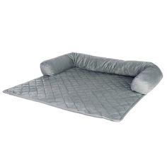 a dog bed that is made out of grey material