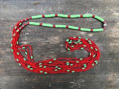 "This graphic, colorful necklace is comprised of 5 long strands of antique white heart glass seed beads. The beads were produced in Venice some time between the late 1800s and 1920 and were never circulated. They were purchased from the consortium of manufacturers that made them in a bulk purchase. The beads were made by hand and there are slight variations in color, size and shape. The strands ere interspersed with small segments of vintage viridian green vulcanite heishi beads from Africa. The Traditional Heart Beads For Jewelry Making, Traditional Green Multi-strand Beads, Traditional Green Multi-strand Beaded Necklaces, Viridian Green, Colorful Necklace, Trade Beads, Heishi Beads, Glass Seed Beads, Colourful Necklace