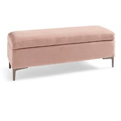 a pink bench sitting on top of a white floor next to a wooden legrest