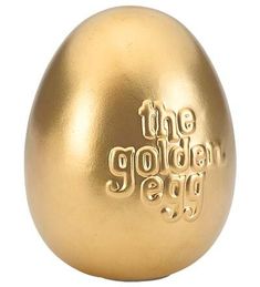 an egg with the golden egg logo on it's side, sitting in front of a white background