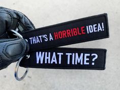 a pair of black gloves with the words that's a horrible idea and what time? on them