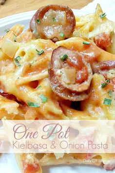 one pot kielbasa and onion pasta on a white plate with the title above it