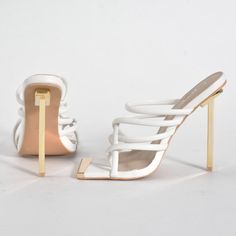 - White Thong Mule - Gold Front Trim - Gold Stiletto Heel - Approx. 4” * Runs True To Size White Strappy Heels With 4-inch Heel, Chic White Strappy Sandals, Elegant White Sandals For Night Out, White Strappy Heels With Padded Heel, White Strappy Heels With Wrapped Heel, Trendy White Strappy Heels, Elegant White Strappy Heels, White Heels With Wrapped Heel For Night Out, Trendy White Heels For Night Out